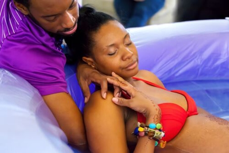 African American couple in a birthing pool